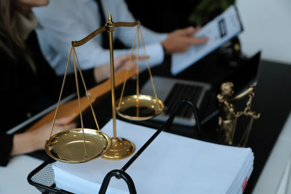 Judge gavel with Justice lawyers having team meeting at law firm